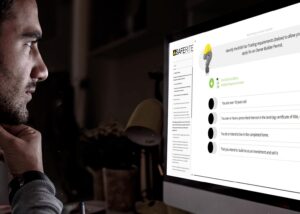a person looking at a computer screen with safe rite owner builder course question