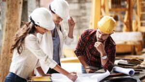 Group of owner builders discussing plans and SAFE RITE Project Management e Kit