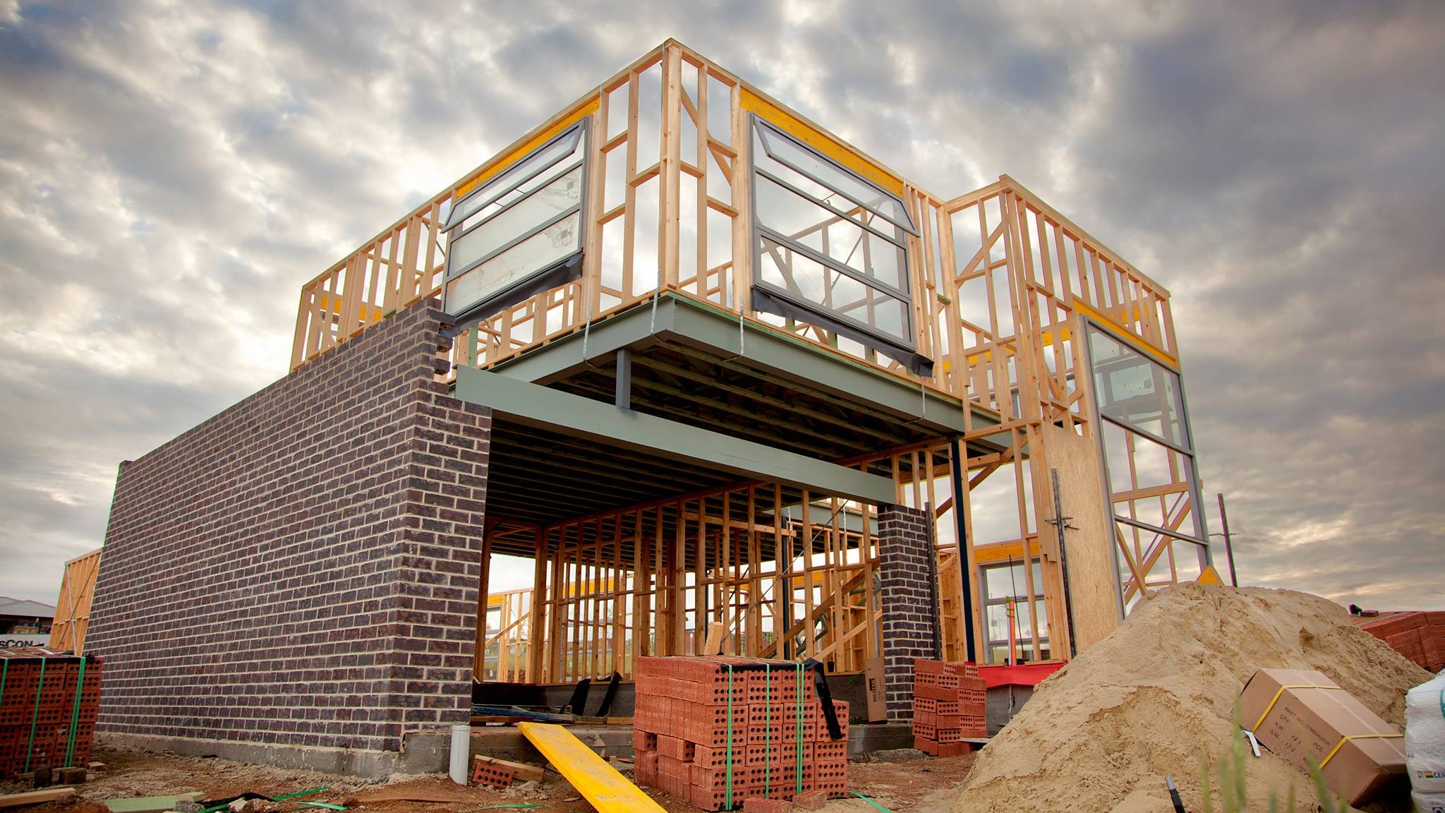 House being built with materials stored all around the site House being built with materials stored all around the site